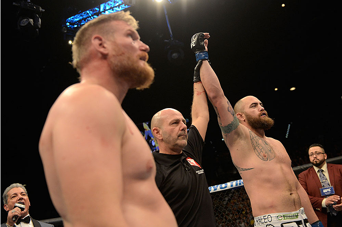 LAS VEGAS, NV - DECEMBER 28:  Travis Browne (right) reacts to his victory over Josh Barnett in their heavyweight bout during the UFC 168 event at the MGM Grand Garden Arena on December 28, 2013 in Las Vegas, Nevada. (Photo by Donald Miralle/Zuffa LLC/Zuffa LLC via Getty Images) *** Local Caption *** Travis Browne