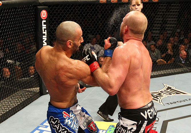LAS VEGAS, NV - DECEMBER 29:  (R-L) Constantinos Philippou punches Tim Boetsch during their middleweight fight at UFC 155 on December 29, 2012 at MGM Grand Garden Arena in Las Vegas, Nevada. (Photo by Josh Hedges/Zuffa LLC/Zuffa LLC via Getty Images) *** Local Caption *** Tim Boetsch; Constantinos Philippou