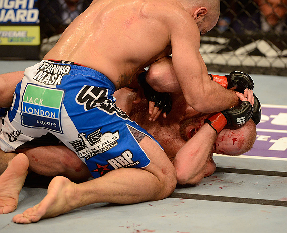 LAS VEGAS, NV - DECEMBER 29:  Constantinos Philippou (top) punches Tim Boetsch during their middleweight fight at UFC 155 on December 29, 2012 at MGM Grand Garden Arena in Las Vegas, Nevada. (Photo by Donald Miralle/Zuffa LLC/Zuffa LLC via Getty Images) *** Local Caption *** Tim Boetsch; Constantinos Philippou