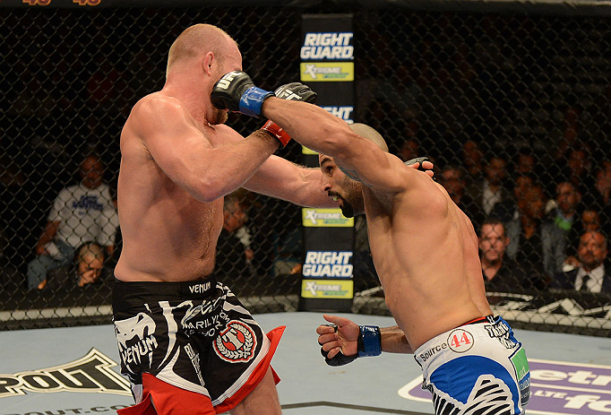 LAS VEGAS, NV - DECEMBER 29:  (R-L) Constantinos Philippou punches Tim Boetsch during their middleweight fight at UFC 155 on December 29, 2012 at MGM Grand Garden Arena in Las Vegas, Nevada. (Photo by Donald Miralle/Zuffa LLC/Zuffa LLC via Getty Images) *** Local Caption *** Tim Boetsch; Constantinos Philippou