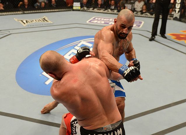 LAS VEGAS, NV - DECEMBER 29:  Constantinos Philippou (top) punches Tim Boetsch during their middleweight fight at UFC 155 on December 29, 2012 at MGM Grand Garden Arena in Las Vegas, Nevada. (Photo by Donald Miralle/Zuffa LLC/Zuffa LLC via Getty Images) *** Local Caption *** Tim Boetsch; Constantinos Philippou