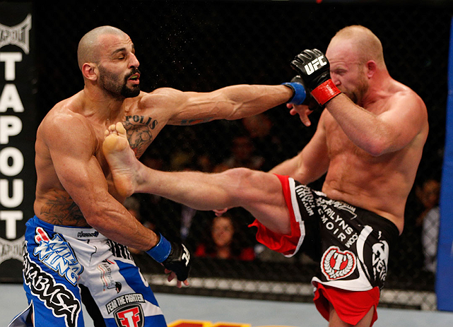 LAS VEGAS, NV - DECEMBER 29:  (R-L) Tim Boetsch kicks Constantinos Philippou during their middleweight fight at UFC 155 on December 29, 2012 at MGM Grand Garden Arena in Las Vegas, Nevada. (Photo by Josh Hedges/Zuffa LLC/Zuffa LLC via Getty Images) *** Local Caption *** Tim Boetsch; Constantinos Philippou