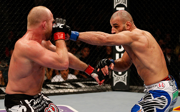 LAS VEGAS, NV - DECEMBER 29:  (R-L) Constantinos Philippou punches Tim Boetsch during their middleweight fight at UFC 155 on December 29, 2012 at MGM Grand Garden Arena in Las Vegas, Nevada. (Photo by Josh Hedges/Zuffa LLC/Zuffa LLC via Getty Images) *** Local Caption *** Tim Boetsch; Constantinos Philippou