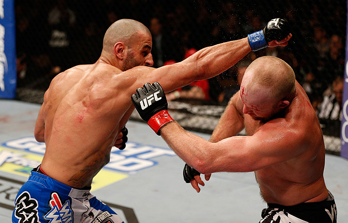 LAS VEGAS, NV - DECEMBER 29:  (L-R) Constantinos Philippou punches Tim Boetsch during their middleweight fight at UFC 155 on December 29, 2012 at MGM Grand Garden Arena in Las Vegas, Nevada. (Photo by Josh Hedges/Zuffa LLC/Zuffa LLC via Getty Images) *** Local Caption *** Tim Boetsch; Constantinos Philippou