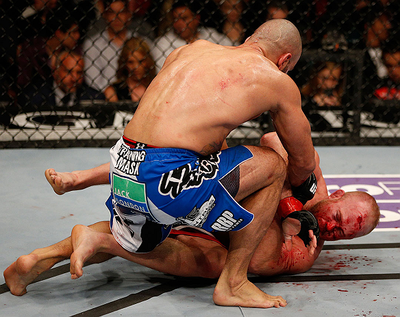 LAS VEGAS, NV - DECEMBER 29:  Constantinos Philippou (top) punches Tim Boetsch during their middleweight fight at UFC 155 on December 29, 2012 at MGM Grand Garden Arena in Las Vegas, Nevada. (Photo by Josh Hedges/Zuffa LLC/Zuffa LLC via Getty Images) *** Local Caption *** Tim Boetsch; Constantinos Philippou