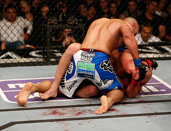 LAS VEGAS, NV - DECEMBER 29:  Constantinos Philippou (top) punches Tim Boetsch during their middleweight fight at UFC 155 on December 29, 2012 at MGM Grand Garden Arena in Las Vegas, Nevada. (Photo by Josh Hedges/Zuffa LLC/Zuffa LLC via Getty Images) *** Local Caption *** Tim Boetsch; Constantinos Philippou