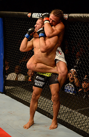 ANAHEIM, CA - FEBRUARY 23: Urijah Faber (white shorts) attempts to submit Ivan Menjivar in their bantamweight bout during UFC 157 at Honda Center on February 23, 2013 in Anaheim, California. (Photo by Donald Miralle/Zuffa LLC/Zuffa LLC via Getty Images) *** Local Caption *** Urijah Faber; Ivan Menjivar