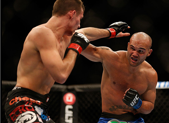 LAS VEGAS, NV - NOVEMBER 16:  (R-L) Robbie Lawler punches Rory MacDonald in their welterweight bout during the UFC 167 event inside the MGM Grand Garden Arena on November 16, 2013 in Las Vegas, Nevada. (Photo by Josh Hedges/Zuffa LLC/Zuffa LLC via Getty Images) *** Local Caption *** Rory MacDonald; Robbie Lawler
