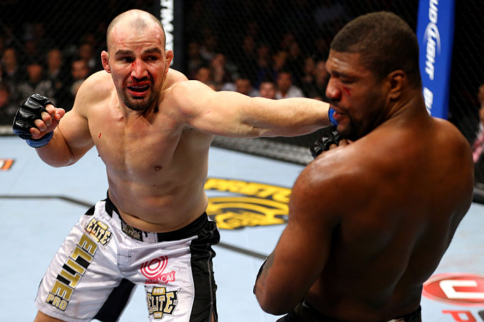 CHICAGO, IL - JANUARY 26:  Glover Teixeira (L) punches Rampage Jackson (R) during their Light Heavyweight Bout part of UFC on FOX at United Center on January 26, 2013 in Chicago, Illinois.  (Photo by Al Bello/Zuffa LLC/Zuffa LLC Via Getty Images)