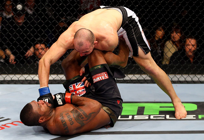 CHICAGO, IL - JANUARY 26:  Glover Teixeira (Top) fights Rampage Jackson (Bottom) during their Light Heavyweight Bout part of UFC on FOX at United Center on January 26, 2013 in Chicago, Illinois.  (Photo by Al Bello/Zuffa LLC/Zuffa LLC Via Getty Images)