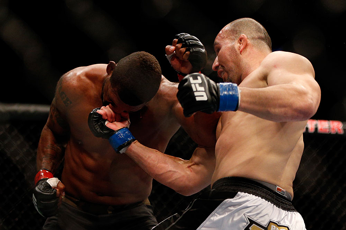CHICAGO, IL - JANUARY 26:  Glover Teixeira (R) punches Rampage Jackson (L) during their Light Heavyweight Bout part of UFC on FOX at United Center on January 26, 2013 in Chicago, Illinois.  (Photo by Josh Hedges/Zuffa LLC/Zuffa LLC Via Getty Images)