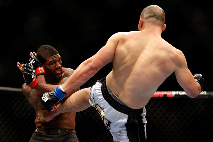 CHICAGO, IL - JANUARY 26:  Glover Teixeira (R) kicks Rampage Jackson (L) during their Light Heavyweight Bout part of UFC on FOX at United Center on January 26, 2013 in Chicago, Illinois.  (Photo by Josh Hedges/Zuffa LLC/Zuffa LLC Via Getty Images)