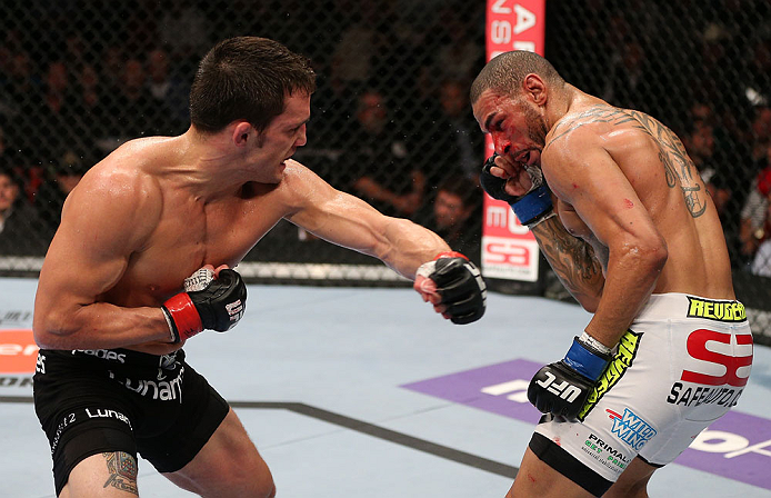MINNEAPOLIS, MN - OCTOBER 05: (L-R) Jake Ellenberger punches Jay Hieron during their welterweight fight at the UFC on FX event at Target Center on October 5, 2012 in Minneapolis, Minnesota. (Photo by Josh Hedges/Zuffa LLC/Zuffa LLC via Getty Images)