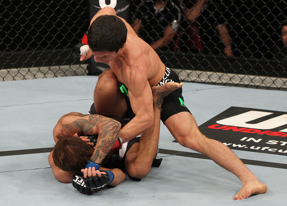 SYDNEY, AUSTRALIA - MARCH 03: (R-L) Joseph Benavidez defeats Yasuhiro Urushitani by TKO due to punches in a flyweight bout during the UFC on FX event at Allphones Arena on March 3, 2012 in Sydney, Australia. (Photo by Josh Hedges/Zuffa LLC/Zuffa LLC via Getty Images) *** Local Caption *** Joseph Benavidez; Yasuhiro Urushitani