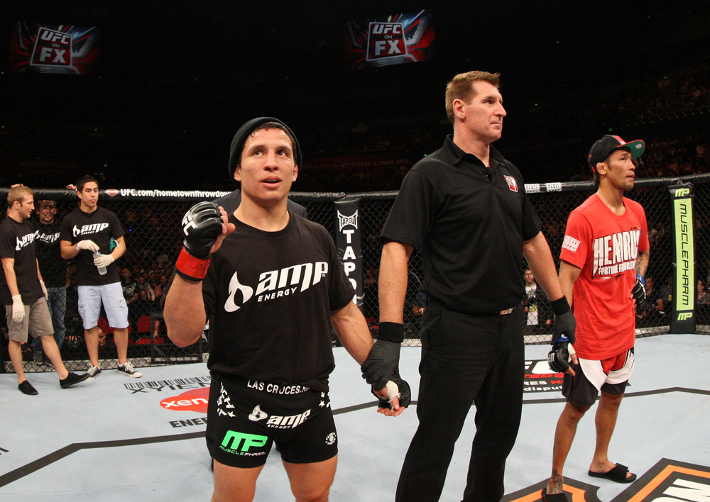 SYDNEY, AUSTRALIA - MARCH 03: Joseph Benavidez (L) reacts after knocking out Yasuhiro Urushitani (R) in a flyweight bout during the UFC on FX event at Allphones Arena on March 3, 2012 in Sydney, Australia. (Photo by Josh Hedges/Zuffa LLC/Zuffa LLC via Getty Images) *** Local Caption *** Joseph Benavidez; Yasuhiro Urushitani
