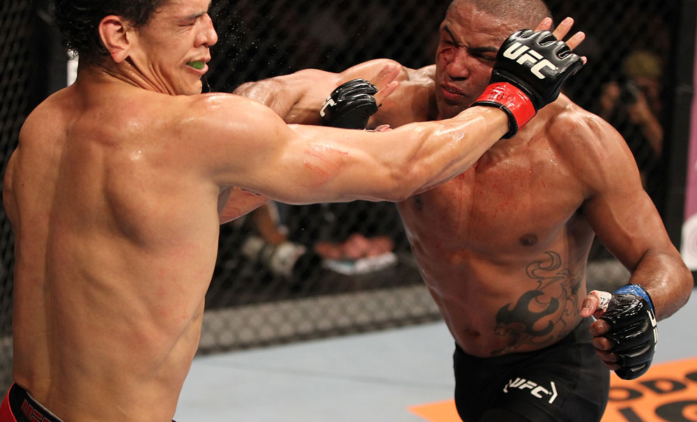 BELO HORIZONTE, BRAZIL - JUNE 23: (R-L) Sergio "Serginho" Moraes punches Cezar "Mutante" Ferreira during their UFC 147 middleweight bout at Estadio Jornalista Felipe Drummond on June 23, 2012 in Belo Horizonte, Brazil. (Photo by Josh Hedges/Zuffa LLC/Zuffa LLC via Getty Images)