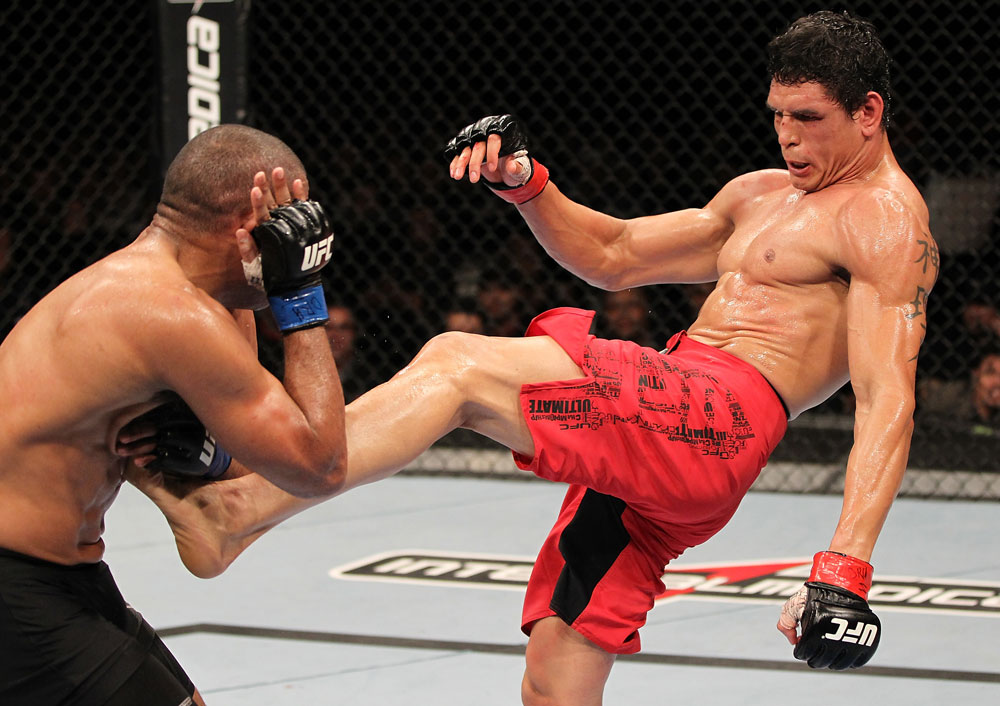 BELO HORIZONTE, BRAZIL - JUNE 23: (R-L) Cezar "Mutante" Ferreira kicks Sergio "Serginho" Moraes during their UFC 147 middleweight bout at Estádio Jornalista Felipe Drummond on June 23, 2012 in Belo Horizonte, Brazil. (Photo by Josh Hedges/Zuffa LLC/Zuffa LLC via Getty Images)
