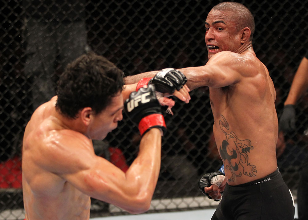 BELO HORIZONTE, BRAZIL - JUNE 23: (R-L) Sergio "Serginho" Moraes punches Cezar "Mutante" Ferreira during their UFC 147 middleweight bout at Estadio Jornalista Felipe Drummond on June 23, 2012 in Belo Horizonte, Brazil. (Photo by Josh Hedges/Zuffa LLC/Zuffa LLC via Getty Images)