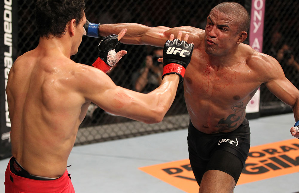 BELO HORIZONTE, BRAZIL - JUNE 23: (R-L) Sergio "Serginho" Moraes punches Cezar "Mutante" Ferreira during their UFC 147 middleweight bout at Estadio Jornalista Felipe Drummond on June 23, 2012 in Belo Horizonte, Brazil. (Photo by Josh Hedges/Zuffa LLC/Zuffa LLC via Getty Images)