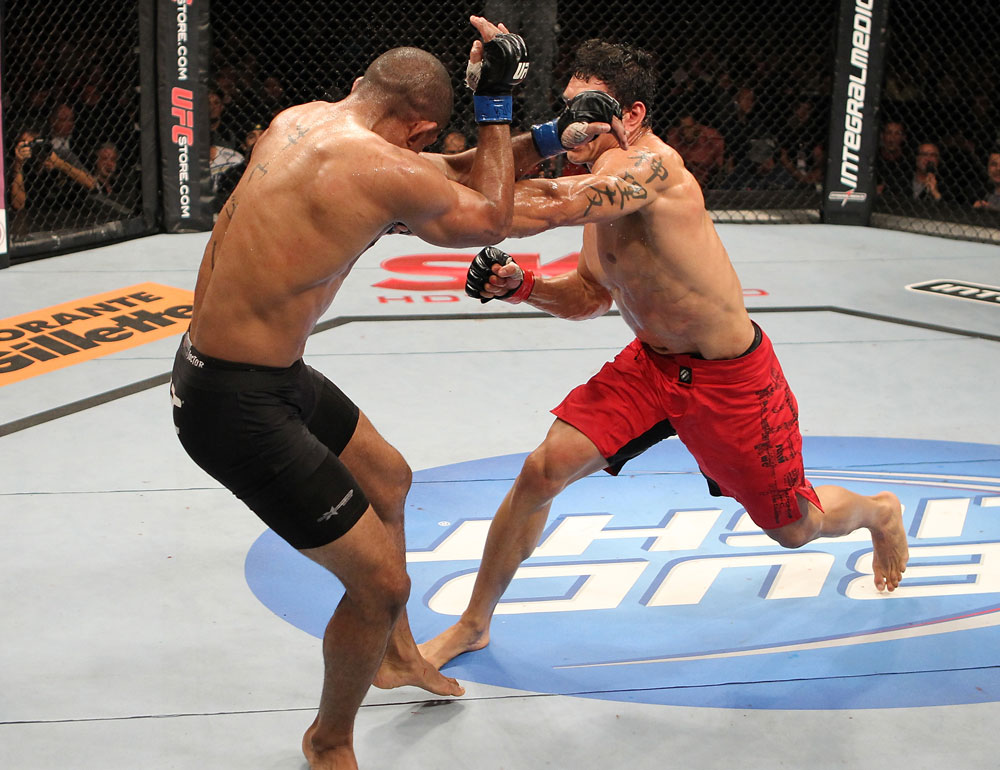 BELO HORIZONTE, BRAZIL - JUNE 23: (R-L) Cezar "Mutante" Ferreira punches Sergio "Serginho" Moraes during their UFC 147 middleweight bout at Estadio Jornalista Felipe Drummond on June 23, 2012 in Belo Horizonte, Brazil. (Photo by Josh Hedges/Zuffa LLC/Zuffa LLC via Getty Images)