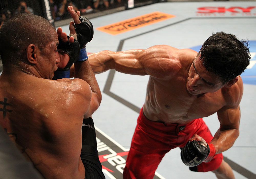 BELO HORIZONTE, BRAZIL - JUNE 23: (R-L) Cezar "Mutante" Ferreira punches Sergio "Serginho" Moraes during their UFC 147 middleweight bout at Estadio Jornalista Felipe Drummond on June 23, 2012 in Belo Horizonte, Brazil. (Photo by Josh Hedges/Zuffa LLC/Zuffa LLC via Getty Images)