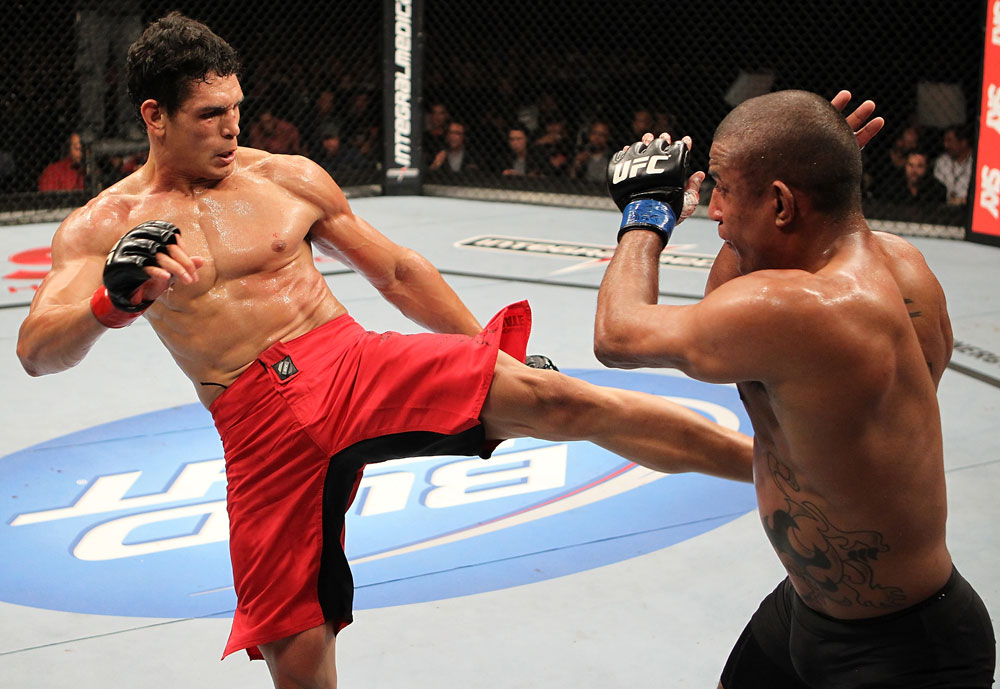 BELO HORIZONTE, BRAZIL - JUNE 23: (L-R) Cezar Ferreira kicks Sergio Moraes during their UFC 147 middleweight bout at Estádio Jornalista Felipe Drummond on June 23, 2012 in Belo Horizonte, Brazil. (Photo by Josh Hedges/Zuffa LLC/Zuffa LLC via Getty Images)