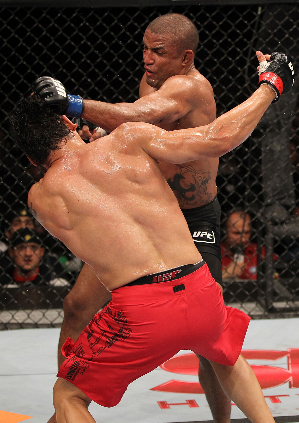 BELO HORIZONTE, BRAZIL - JUNE 23: (R-L) Sergio "Serginho" Moraes punches Cezar "Mutante" Ferreira during their UFC 147 middleweight bout at Estadio Jornalista Felipe Drummond on June 23, 2012 in Belo Horizonte, Brazil. (Photo by Josh Hedges/Zuffa LLC/Zuffa LLC via Getty Images)