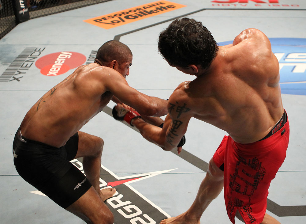 BELO HORIZONTE, BRAZIL - JUNE 23: (R-L) Cezar "Mutante" Ferreira punches Sergio "Serginho" Moraes during their UFC 147 middleweight bout at Estadio Jornalista Felipe Drummond on June 23, 2012 in Belo Horizonte, Brazil. (Photo by Josh Hedges/Zuffa LLC/Zuffa LLC via Getty Images)