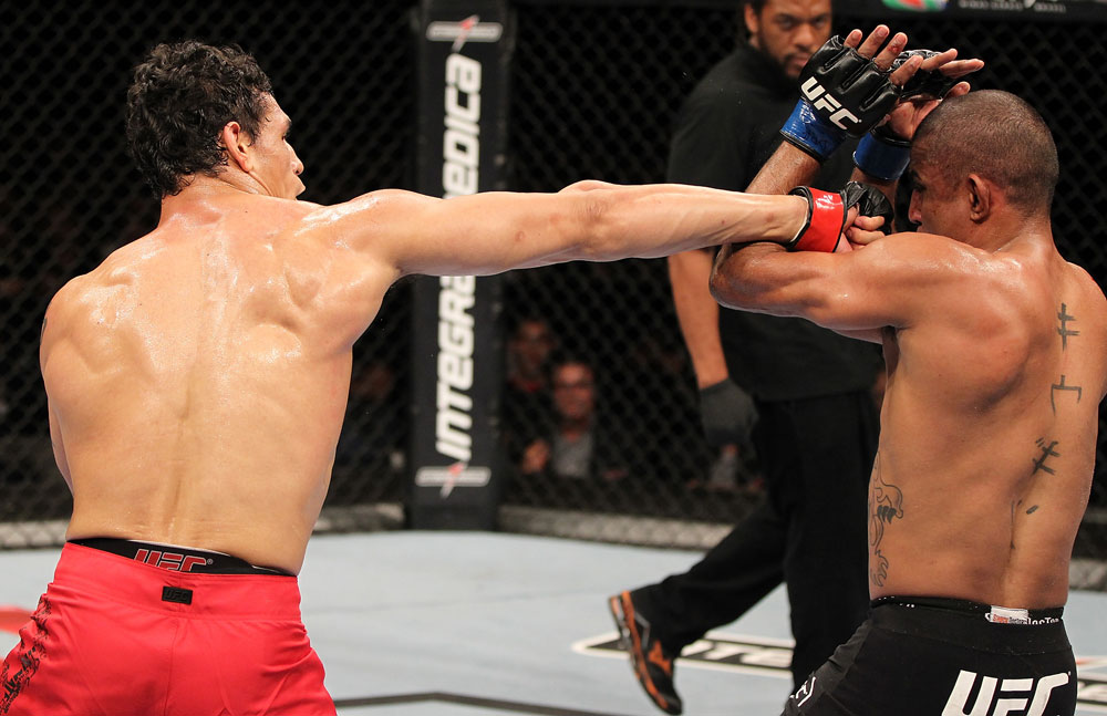 BELO HORIZONTE, BRAZIL - JUNE 23: (L-R) Cezar "Mutante" Ferreira punches Sergio "Serginho" Moraes during their UFC 147 middleweight bout at Estadio Jornalista Felipe Drummond on June 23, 2012 in Belo Horizonte, Brazil. (Photo by Josh Hedges/Zuffa LLC/Zuffa LLC via Getty Images)
