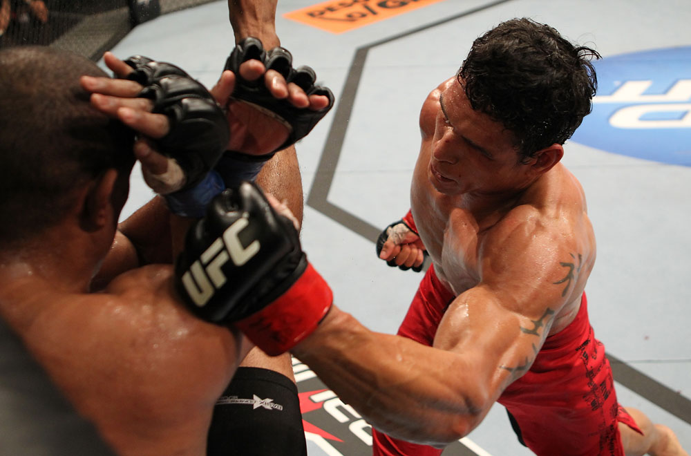 BELO HORIZONTE, BRAZIL - JUNE 23: (R-L) Cezar "Mutante" Ferreira punches Sergio "Serginho" Moraes during their UFC 147 middleweight bout at Estadio Jornalista Felipe Drummond on June 23, 2012 in Belo Horizonte, Brazil. (Photo by Josh Hedges/Zuffa LLC/Zuffa LLC via Getty Images)