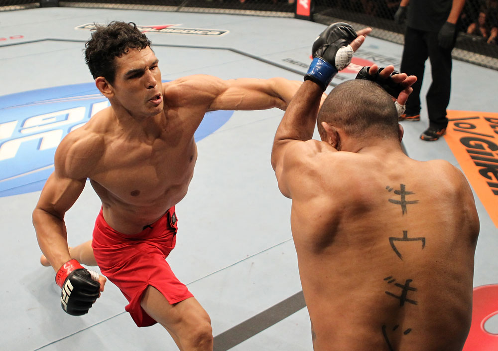 BELO HORIZONTE, BRAZIL - JUNE 23: (L-R) Cezar "Mutante" Ferreira punches Sergio "Serginho" Moraes during their UFC 147 middleweight bout at Estadio Jornalista Felipe Drummond on June 23, 2012 in Belo Horizonte, Brazil. (Photo by Josh Hedges/Zuffa LLC/Zuffa LLC via Getty Images)