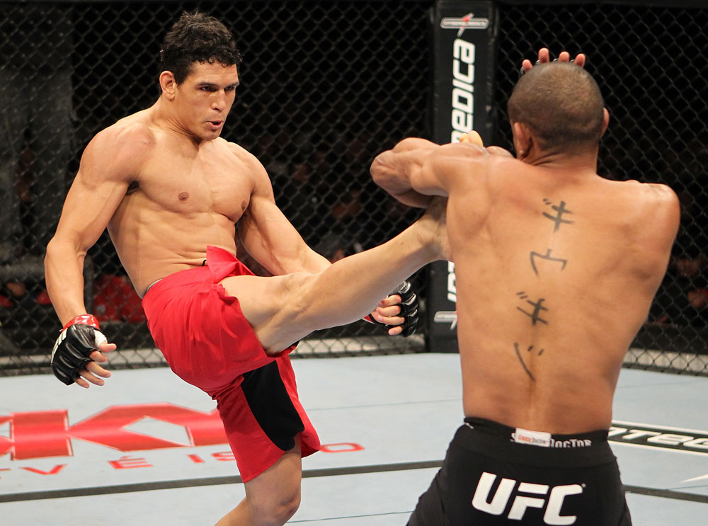 BELO HORIZONTE, BRAZIL - JUNE 23: (R-L) Cezar Ferreira kicks Sergio Moraes during their UFC 147 middleweight bout at Estádio Jornalista Felipe Drummond on June 23, 2012 in Belo Horizonte, Brazil. (Photo by Josh Hedges/Zuffa LLC/Zuffa LLC via Getty Images)