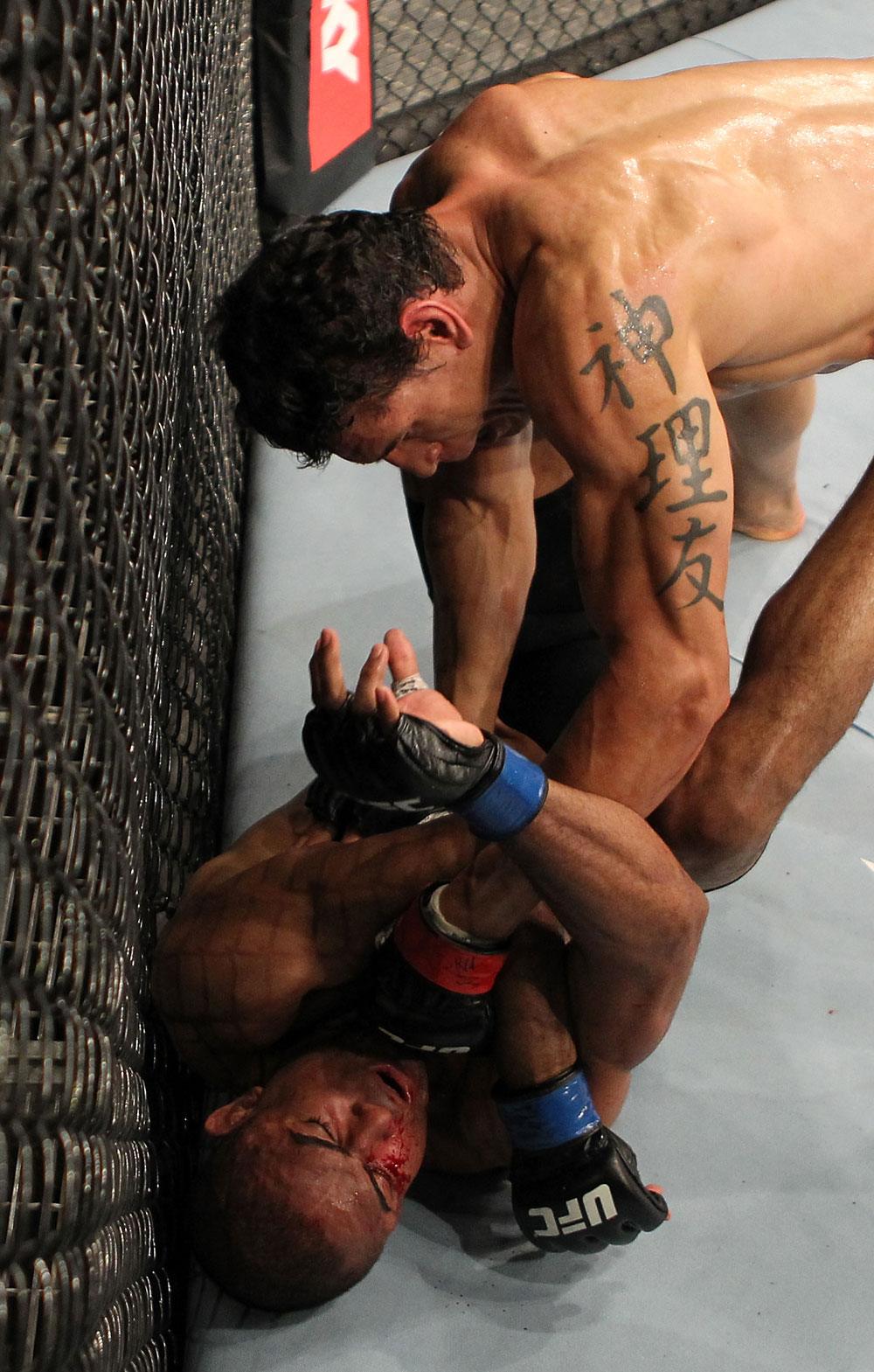 BELO HORIZONTE, BRAZIL - JUNE 23: (R-L) Cezar "Mutante" Ferreira punches Sergio "Serginho" Moraes during their UFC 147 middleweight bout at Estadio Jornalista Felipe Drummond on June 23, 2012 in Belo Horizonte, Brazil. (Photo by Josh Hedges/Zuffa LLC/Zuffa LLC via Getty Images)