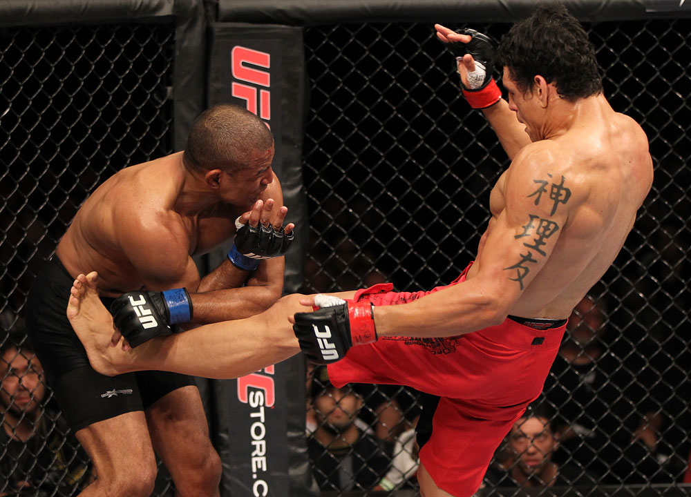 BELO HORIZONTE, BRAZIL - JUNE 23: (R-L) Cezar "Mutante" Ferreira kicks Sergio "Serginho" Moraes during their UFC 147 middleweight bout at Estádio Jornalista Felipe Drummond on June 23, 2012 in Belo Horizonte, Brazil. (Photo by Josh Hedges/Zuffa LLC/Zuffa LLC via Getty Images)