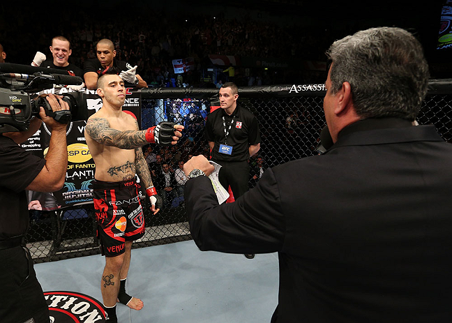 NOTTINGHAM, ENGLAND - SEPTEMBER 29: Dan Hardy (L) is introduced by Bruce Buffer before his welterweight fight against Amir Sadollah at the UFC on Fuel TV event at Capital FM Arena on September 29, 2012 in Nottingham, England. (Photo by Josh Hedges/Zuffa LLC/Zuffa LLC via Getty Images)