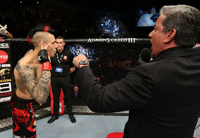 NOTTINGHAM, ENGLAND - SEPTEMBER 29: Dan Hardy (L) is introduced by Bruce Buffer before his welterweight fight against Amir Sadollah at the UFC on Fuel TV event at Capital FM Arena on September 29, 2012 in Nottingham, England. (Photo by Josh Hedges/Zuffa LLC/Zuffa LLC via Getty Images)
