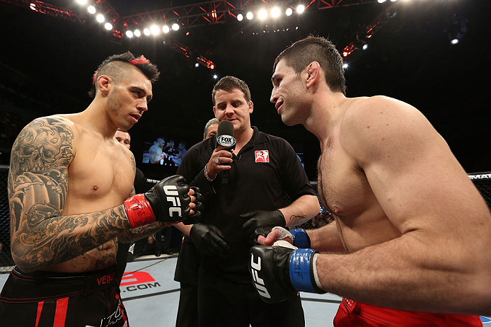NOTTINGHAM, ENGLAND - SEPTEMBER 29: Opponents Dan Hardy (L) and Amir Sadollah (R) receive final instructions from referee Mark Goddard before their welterweight fight at the UFC on Fuel TV event at Capital FM Arena on September 29, 2012 in Nottingham, England. (Photo by Josh Hedges/Zuffa LLC/Zuffa LLC via Getty Images)