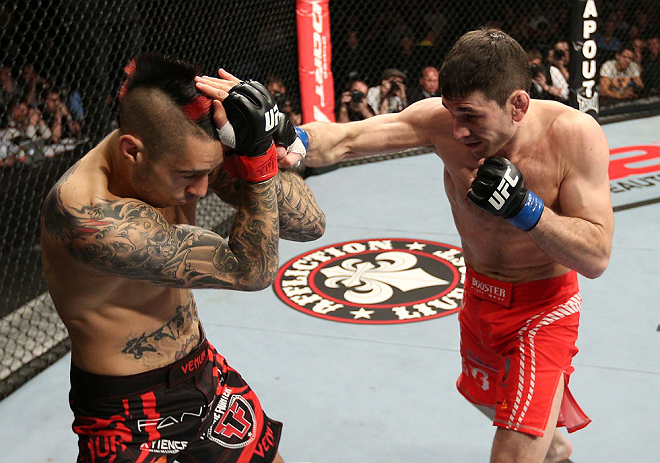 NOTTINGHAM, ENGLAND - SEPTEMBER 29: (R-L) Amir Sadollah punches Dan Hardy during their welterweight fight at the UFC on Fuel TV event at Capital FM Arena on September 29, 2012 in Nottingham, England. (Photo by Josh Hedges/Zuffa LLC/Zuffa LLC via Getty Images)