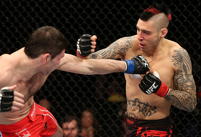 NOTTINGHAM, ENGLAND - SEPTEMBER 29: (R-L) Dan Hardy punches Amir Sadollah during their welterweight fight at the UFC on Fuel TV event at Capital FM Arena on September 29, 2012 in Nottingham, England. (Photo by Josh Hedges/Zuffa LLC/Zuffa LLC via Getty Images)