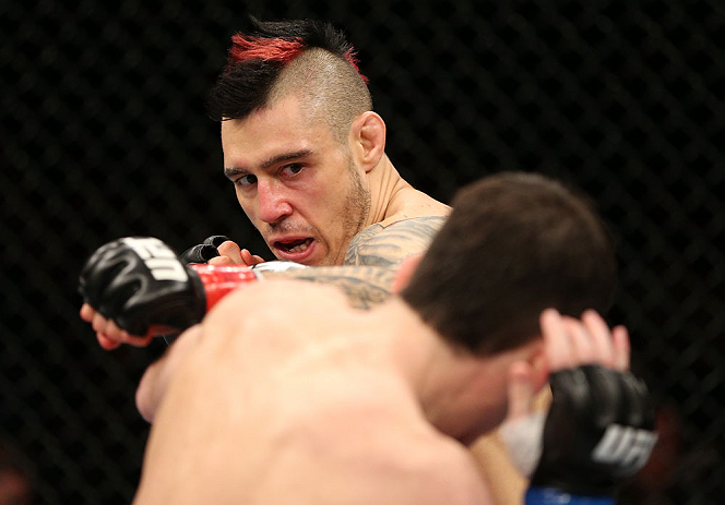 NOTTINGHAM, ENGLAND - SEPTEMBER 29: (L-R) Dan Hardy punches Amir Sadollah during their welterweight fight at the UFC on Fuel TV event at Capital FM Arena on September 29, 2012 in Nottingham, England. (Photo by Josh Hedges/Zuffa LLC/Zuffa LLC via Getty Images)
