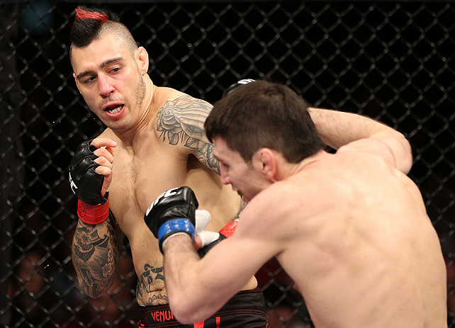 NOTTINGHAM, ENGLAND - SEPTEMBER 29: (L-R) Dan Hardy punches Amir Sadollah during their welterweight fight at the UFC on Fuel TV event at Capital FM Arena on September 29, 2012 in Nottingham, England. (Photo by Josh Hedges/Zuffa LLC/Zuffa LLC via Getty Images)