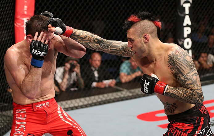NOTTINGHAM, ENGLAND - SEPTEMBER 29: (R-L) Dan Hardy punches Amir Sadollah during their welterweight fight at the UFC on Fuel TV event at Capital FM Arena on September 29, 2012 in Nottingham, England. (Photo by Josh Hedges/Zuffa LLC/Zuffa LLC via Getty Images)