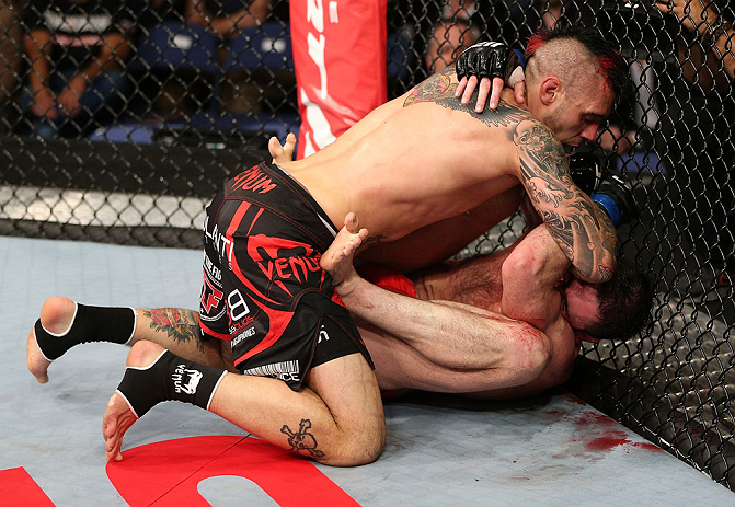 NOTTINGHAM, ENGLAND - SEPTEMBER 29: (L-R) Dan Hardy delivers an elbow strike against Amir Sadollah during their welterweight fight at the UFC on Fuel TV event at Capital FM Arena on September 29, 2012 in Nottingham, England. (Photo by Josh Hedges/Zuffa LLC/Zuffa LLC via Getty Images)