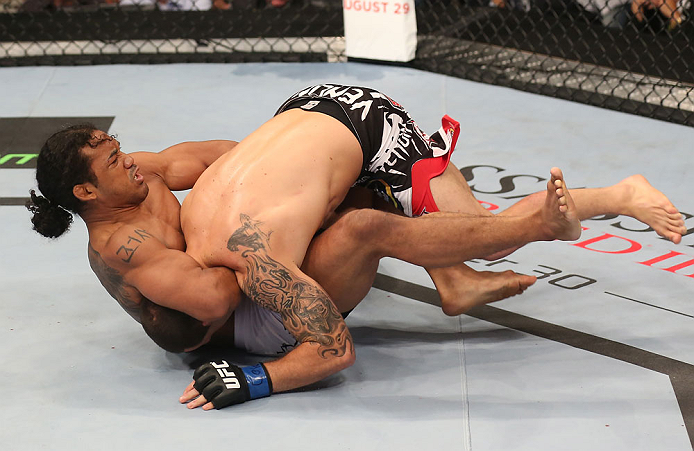 DENVER, CO - AUGUST 11: (R-L) Benson Henderson attempts a guillotine choke submission against Frankie Edgar during their lightweight championship bout at UFC 150 inside Pepsi Center on August 11, 2012 in Denver, Colorado. (Photo by Nick Laham/Zuffa LLC/Zuffa LLC via Getty Images)