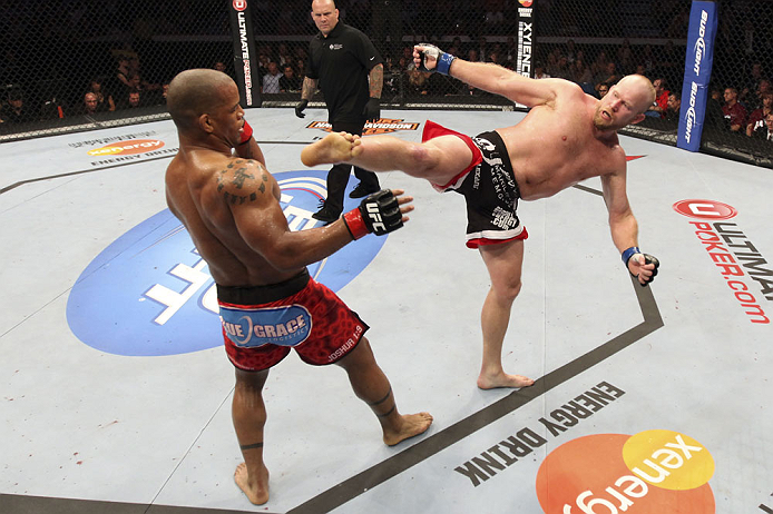 CALGARY, CANADA - JULY 21:  (L-R) Hector Lombard exchanges punches with Tim Boetsch during their middleweight bout at UFC 149 inside the Scotiabank Saddledome on July 21, 2012 in Calgary, Alberta, Canada.  (Photo by Nick Laham/Zuffa LLC/Zuffa LLC via Getty Images)