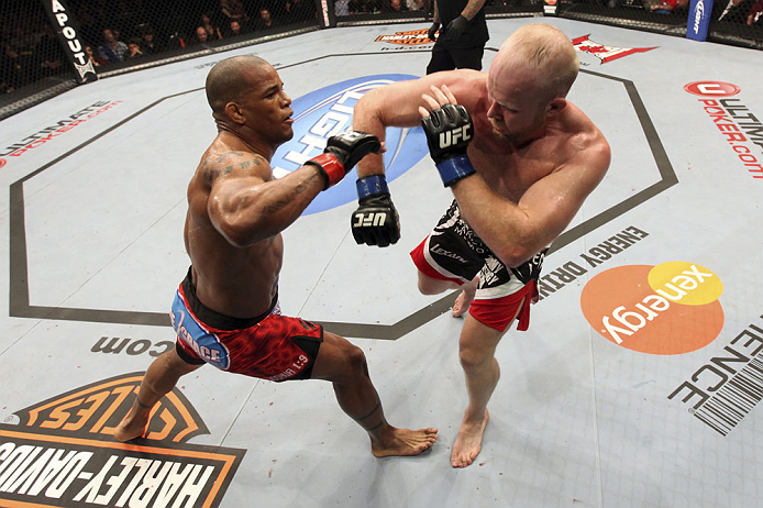 CALGARY, CANADA - JULY 21:  (L-R) Hector Lombard exchanges punches with Tim Boetsch during their middleweight bout at UFC 149 inside the Scotiabank Saddledome on July 21, 2012 in Calgary, Alberta, Canada.  (Photo by Nick Laham/Zuffa LLC/Zuffa LLC via Getty Images)