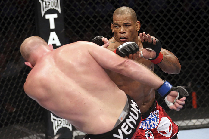 CALGARY, CANADA - JULY 21: (R-L) Hector Lombard throws a punch at Tim Boetsch during their middleweight bout at UFC 149 inside the Scotiabank Saddledome on July 21, 2012 in Calgary, Alberta, Canada.  (Photo by Nick Laham/Zuffa LLC/Zuffa LLC via Getty Images)
