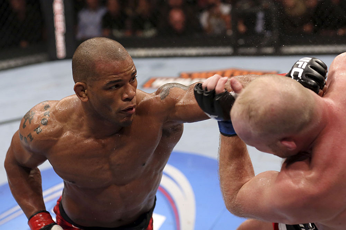 CALGARY, CANADA - JULY 21: (L-R) Hector Lombard throws a punch at Tim Boetsch during their middleweight bout at UFC 149 inside the Scotiabank Saddledome on July 21, 2012 in Calgary, Alberta, Canada.  (Photo by Nick Laham/Zuffa LLC/Zuffa LLC via Getty Images)