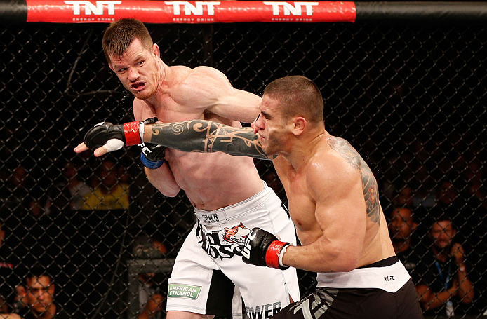 SAO PAULO, BRAZIL - JANUARY 19: (L-R) C.B. Dolloway punches Daniel Sarafian in their middleweight fight at the UFC on FX event on January 19, 2013 at Ibirapuera Gymnasium in Sao Paulo, Brazil. (Photo by Josh Hedges/Zuffa LLC/Zuffa LLC via Getty Images)
