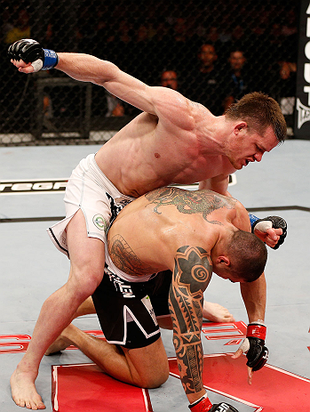 SAO PAULO, BRAZIL - JANUARY 19: (L-R) C.B. Dolloway punches Daniel Sarafian in their middleweight fight at the UFC on FX event on January 19, 2013 at Ibirapuera Gymnasium in Sao Paulo, Brazil. (Photo by Josh Hedges/Zuffa LLC/Zuffa LLC via Getty Images)